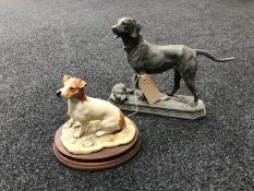 A spelter figure of a gun dog with bird and resin figure of a Jack Russell