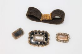 A group of early 19th century memoriam jewellery including a hair bracelet with high carat gold
