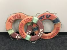 Three wooden life rings, Port of Docklands, St Ives Cornwall,