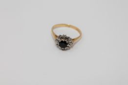 An 18ct gold diamond and sapphire cluster ring CONDITION REPORT: Size O.