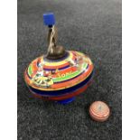A mid 20th century Chad Valley tin plate spinning top and a tin plate yo-yo