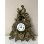 An ornate brass Imperial mantel clock,