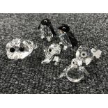 Six un-boxed Swarovski Crystal figures; frog, puffer fish, walrus and three penguins.