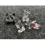 Four un-boxed Swarovski Crystal figures;