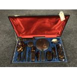 A twelve piece tortoise shell dressing table set in a fitted box together with a horn cased