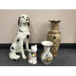 A large figure of a Setter together with a pottery figure of a cat,