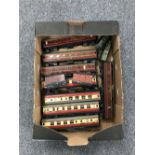 A box containing approximately twelve early tin plate railway carriages and railway boxcars by