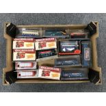 A box containing approximately fourteen die cast buses,