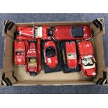 A box containing seven die cast Burago large scale die cast vehicles