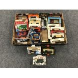 A box containing approximately twenty eight boxed die cast vehicles,