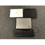 A box containing three laptops, Toshiba, Asus and IBM,