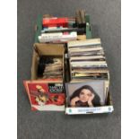 A box of LP's, rock and pop, together with a small box of 45 singles and a box of books, flowers,