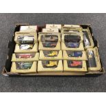 A box containing approximately twenty boxed die cast vehicles,