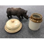 A large figure of a rhinoceros together with a stoneware pot and a cheese dish with cover