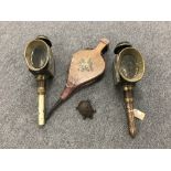 A tray containing a pair of antique brass coach lamps, a set of bellows,