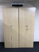 A pair of contemporary office stationary cupboards in a beech finish