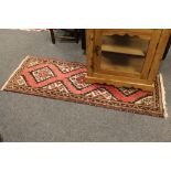 A North West Persian rug on pink ground,
