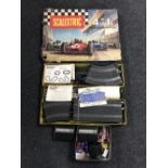 A boxed vintage Scalextric set with accessories