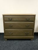 A 20th century painted pine three drawer chest