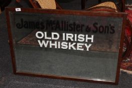 An early twentieth century mahogany framed mirror -James McAllister and Sons Old Irish Whiskey