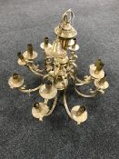 A brass twelve branch chandelier