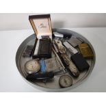 A tray containing assorted lighters including a boxed Calbri lighter,