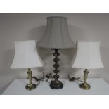 A pair of brass table lamps, with shades,