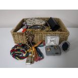 A basket containing a quantity of assorted costume jewellery, including necklaces, earrings,