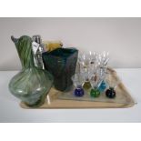 A tray containing assorted glassware, including a lidded beer stein, wine glasses,