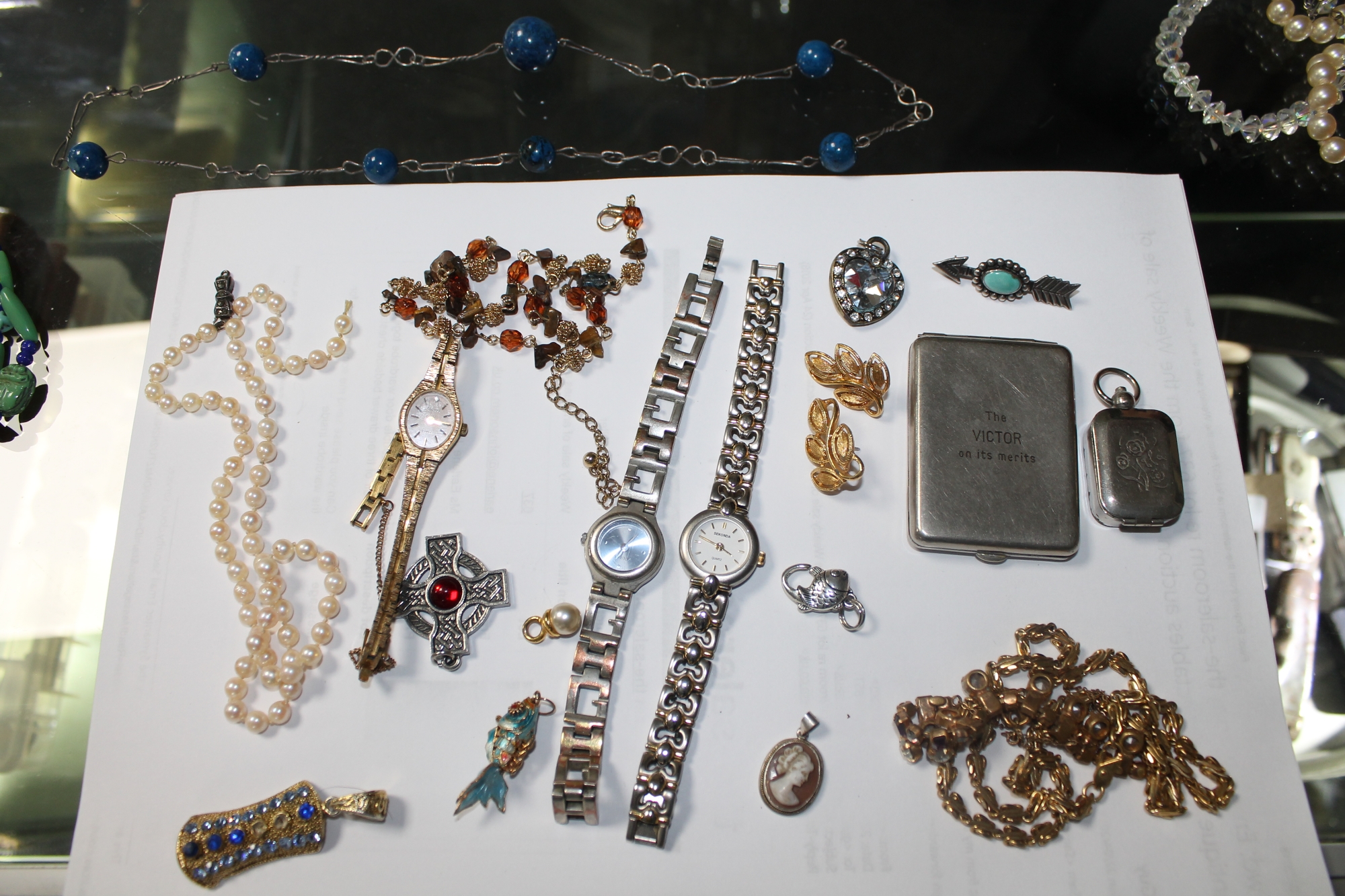 A tin of costume jewellery including silver pieces, - Image 3 of 4