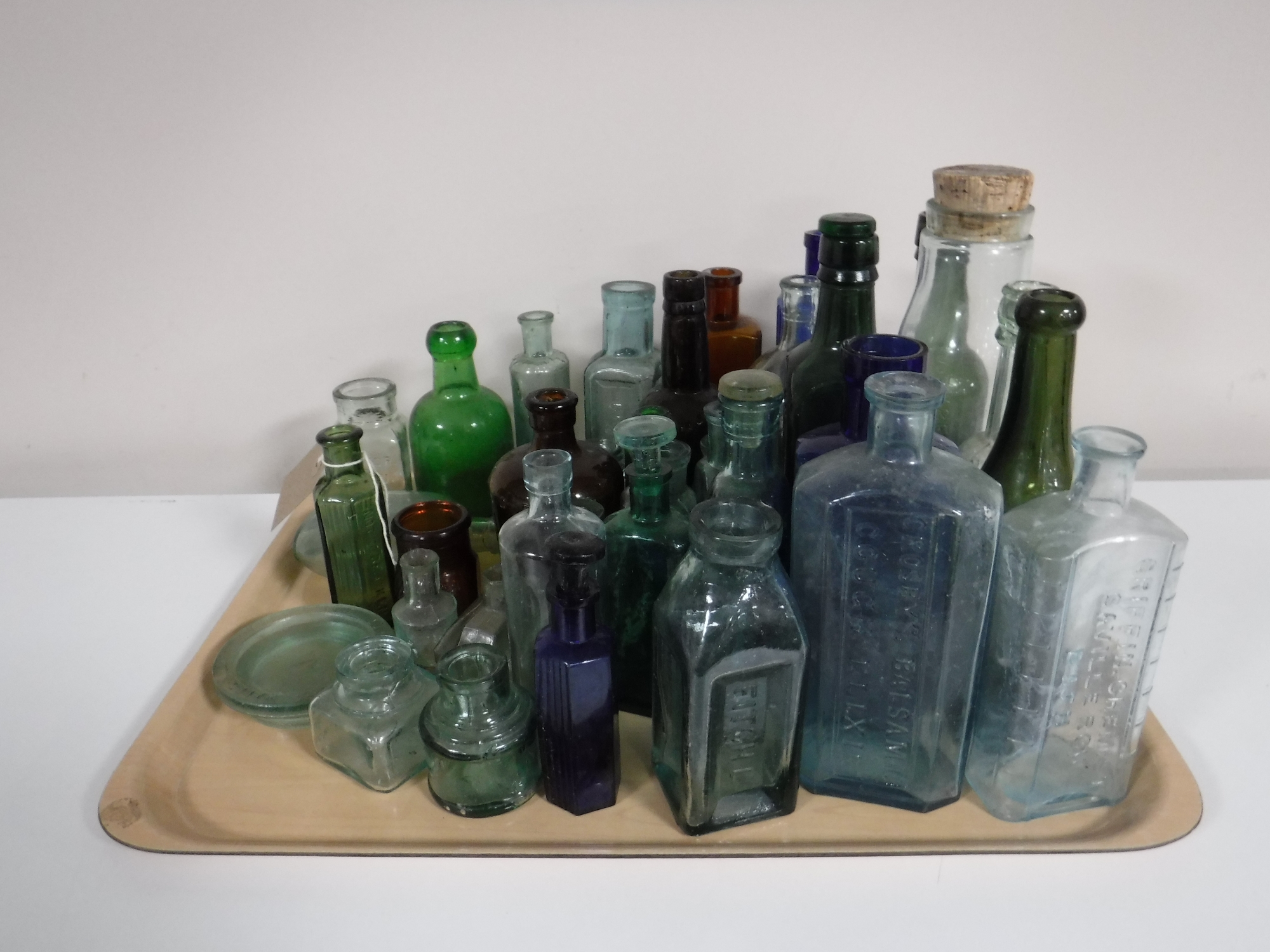 A tray containing vintage bottles