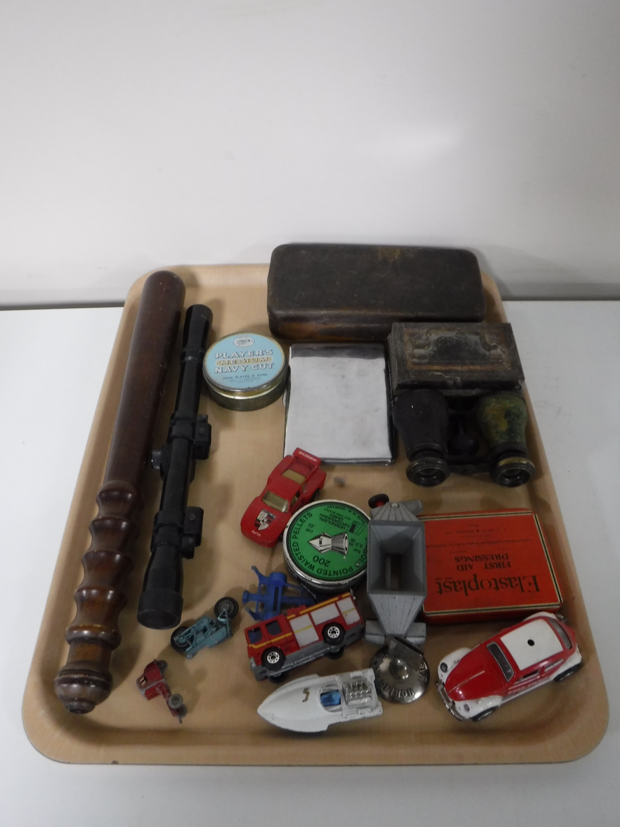 A tray containing a policeman's truncheon, a Nikko sterling air rifle scope, air rifle pellets,