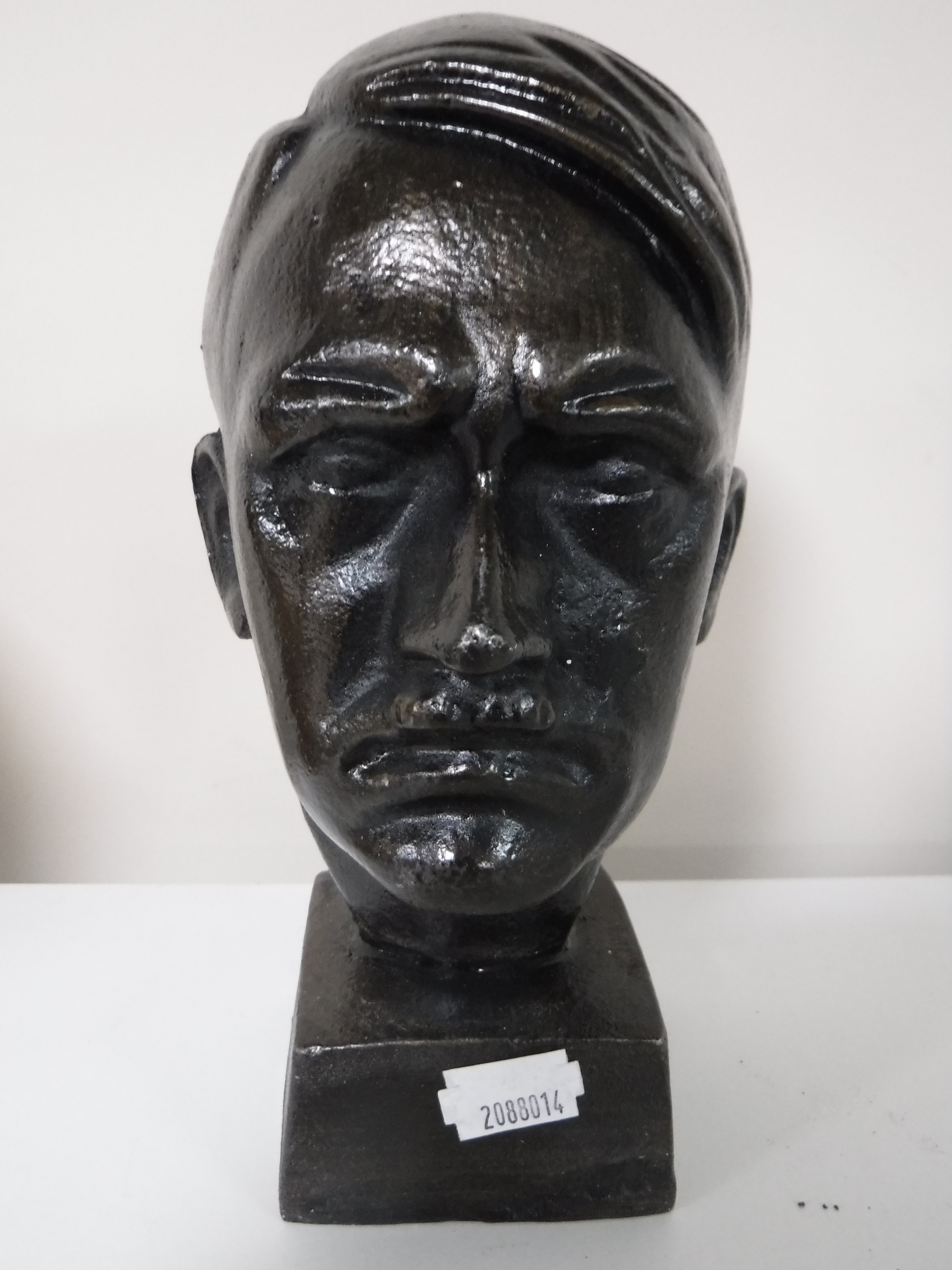 A cast metal bust of Hitler