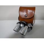 A set of cased Ginza 10x20 miniature binoculars
