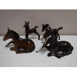 Four Beswick foal figures (brown gloss)