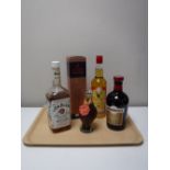 Five bottles of alcohol including Famous Grouse, Stag Royal Canadian Spirit,