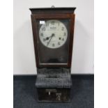 An oak cased Blick Time Recorders Limited clocking in machine