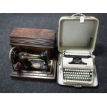 A cased Olympia typewriter and a mahogany cased Singer sewing machine