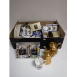 A box of Ringtons china : mugs, teapots, wall plates, etc,