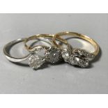 Two 18ct white gold diamond set rings, 4.4g, together with a 9ct diamond cluster ring.