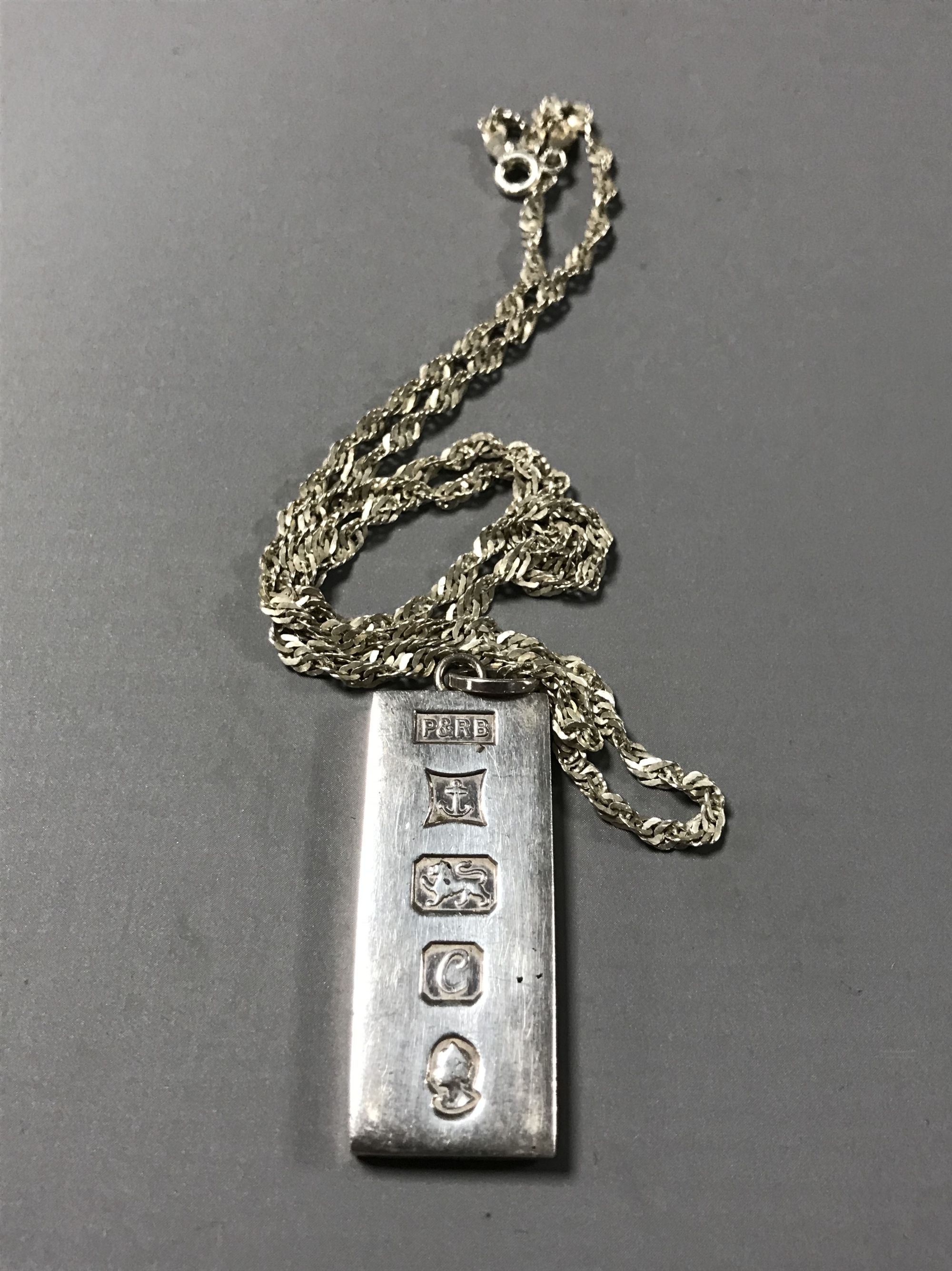 A silver ingot on sterling silver chain