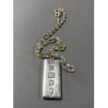 A silver ingot on sterling silver chain