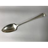 A Georgian silver serving spoon, London 1803.