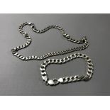 A silver curb bracelet together with a silver necklace. (2) CONDITION REPORT: 81.9g.