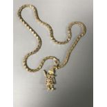 A 9ct gold clown charm pendant on 9ct gold chain, 9.3g.