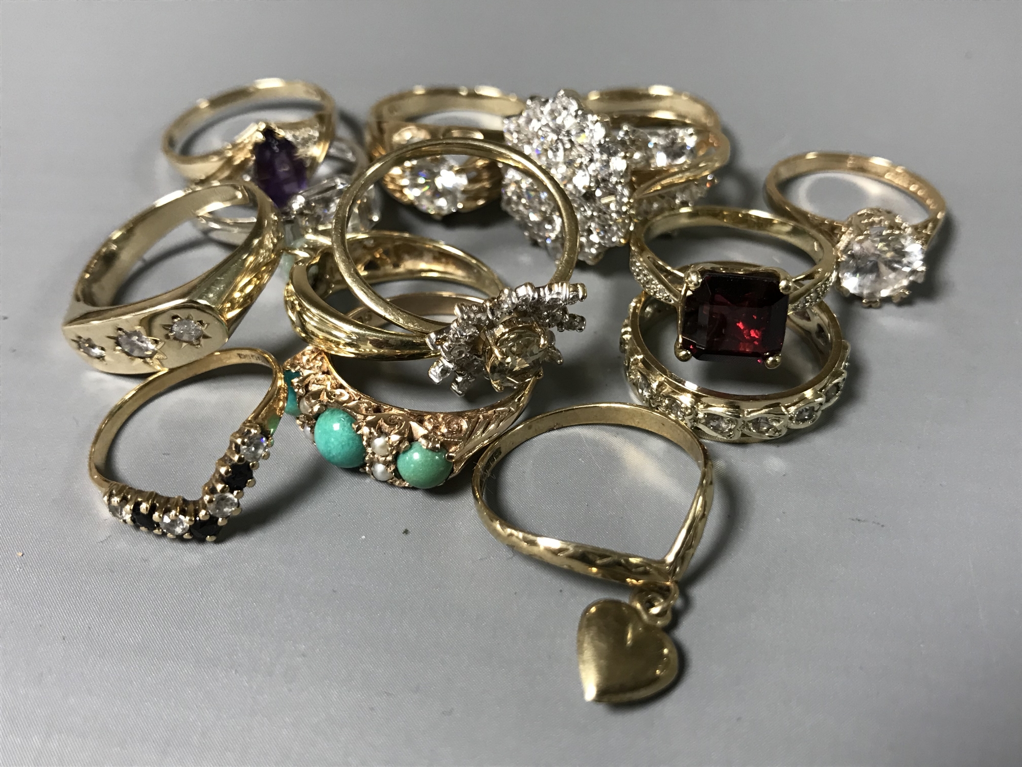 A collection of fourteen 9ct gold dress rings set with various stones, 42g.