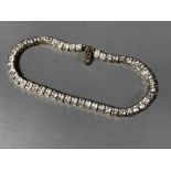 A 9ct gold tennis bracelet set with cubic zirconia, 9.7g.