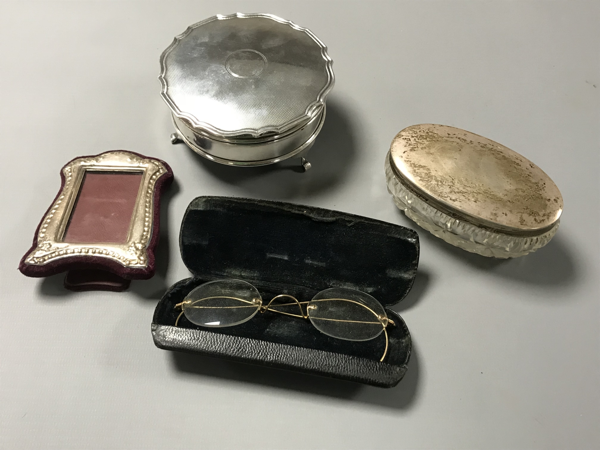 A silver dressing table casket, together with a silver dressing table pot,