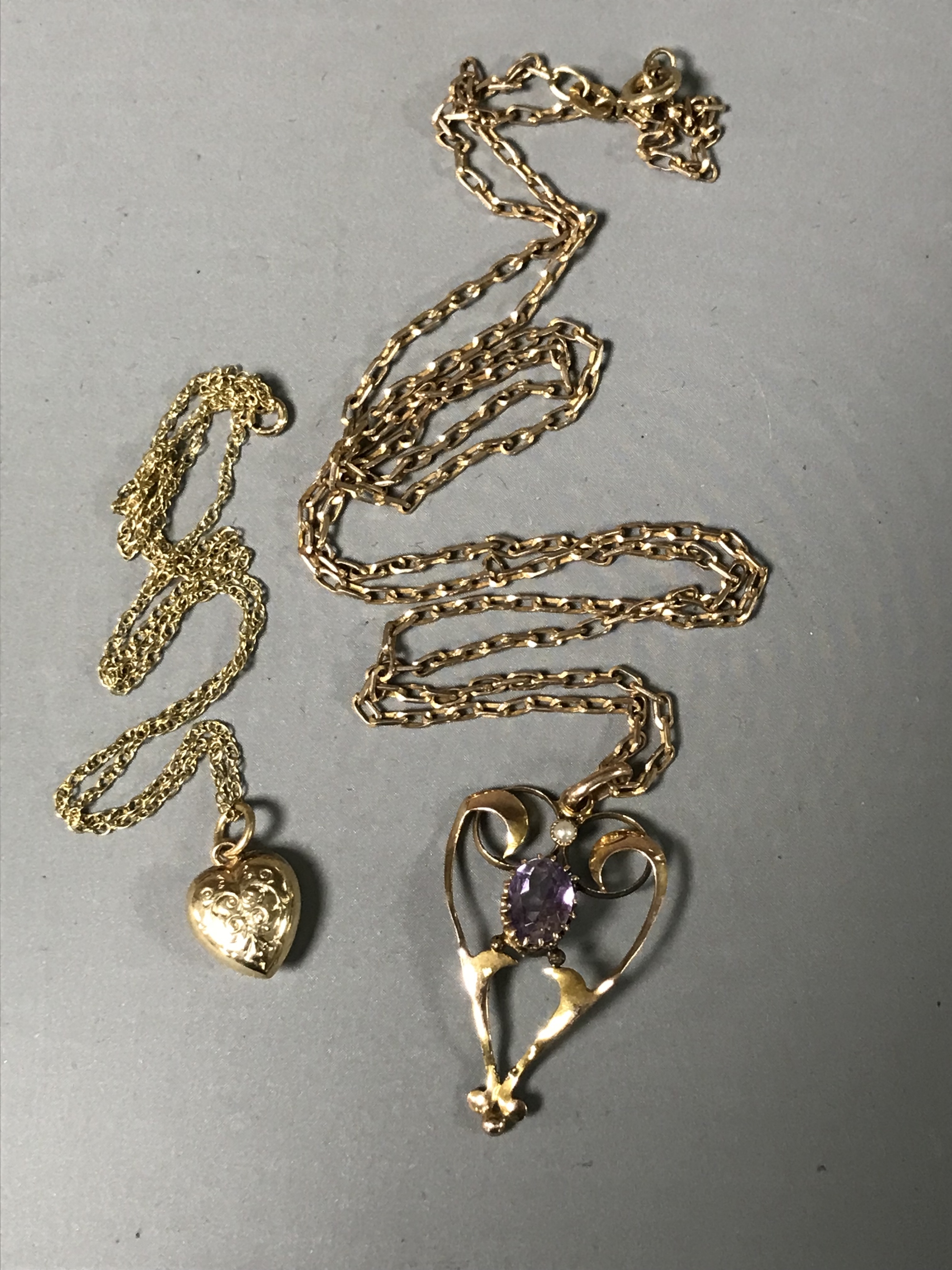 A 9ct gold Victorian pendant on chain together with a 9ct gold heart on chain.