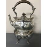 A good quality silver plated spirit kettle on stand with burner.